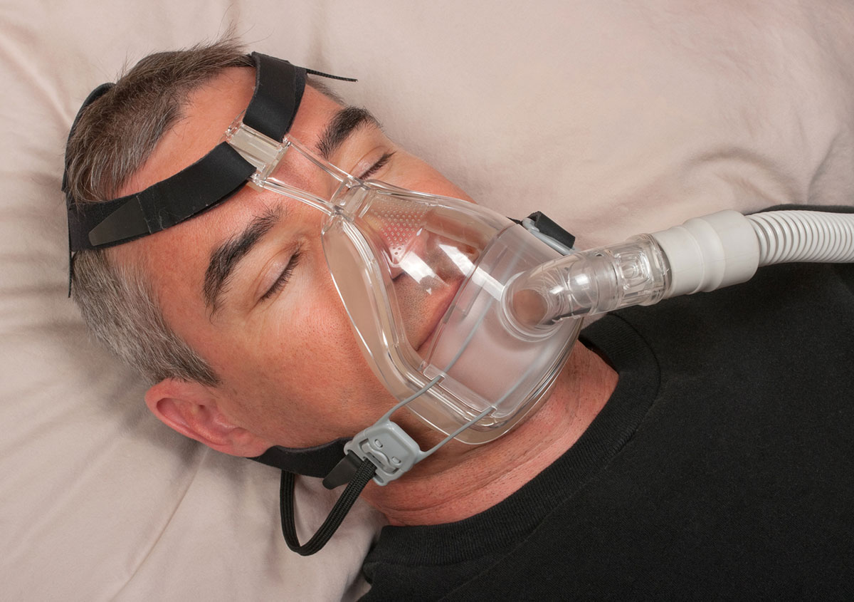A man is having sleep apnea treatment