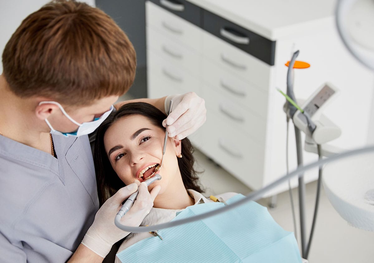 A woman is having dental surgery