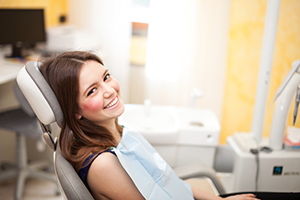 Girl on a dental chair smiling