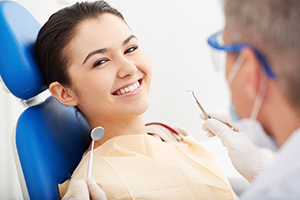 Smiling girl on a dental chair
