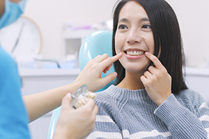 Girl pointing at her teeth